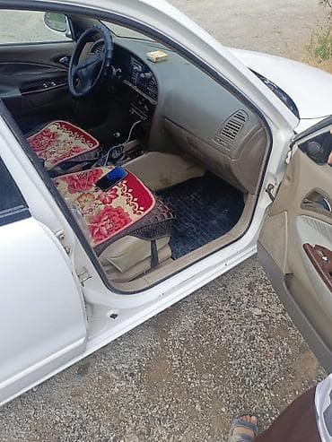 машина некция: Daewoo Nubira: 2000 г., Седан — 9