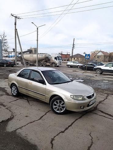 Mazda 323: 2000 г., 1.5 л, Механика, Бензин, Седан