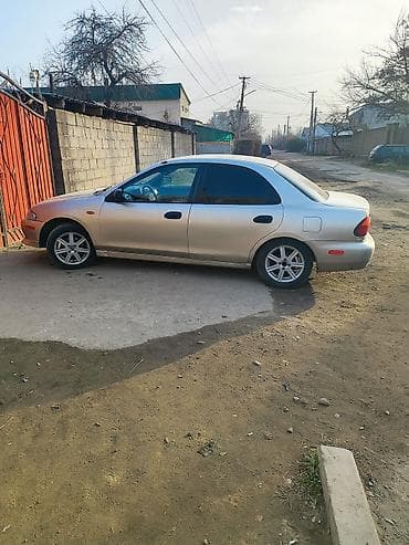 автомобиль сузуки: Mazda 323: 1998 г., 1.5 л, Автомат, Бензин, Седан — 9