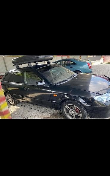 corolla e150: Mazda 323: 2002 г., 1.6 л, Бензин, Хэтчбэк — 4