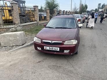 Mazda 323: 2001 г., 1.6 л, Механика, Бензин, Универсал