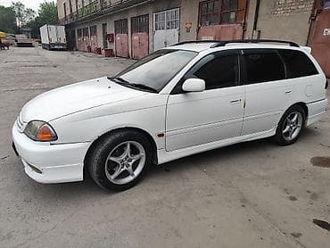 corolla e150: Универсал белого цвета, правый руль. Просторный кузов с большим — 3