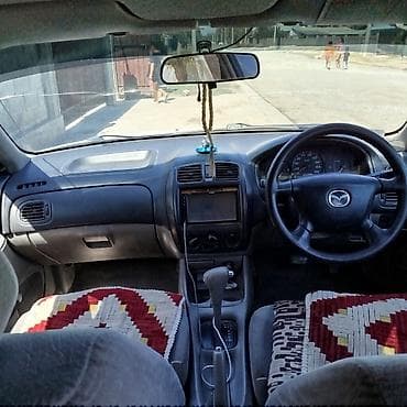 gac gs3: Mazda Familia: 2001 г., 1.3 л, Автомат, Бензин, Седан — 8