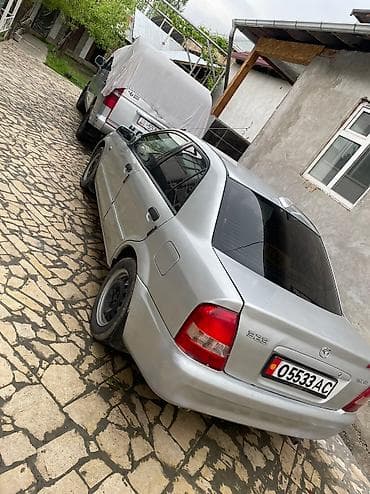 crv 5: Mazda 323: 2003 г., 1.4 л, Механика, Бензин, Седан — 3