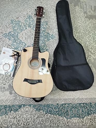 ретро радио: Акустическая гитара с вырезом (cutaway) формата дредноут — 2