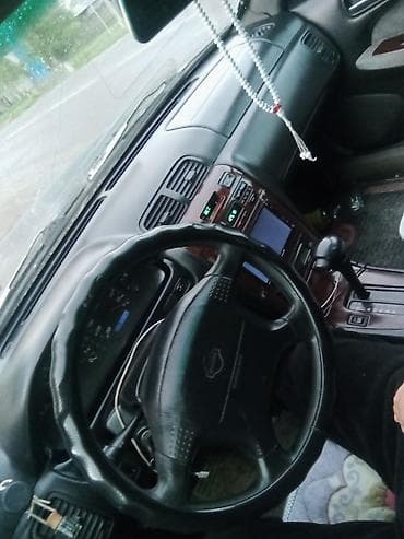 выкуп авто мазда: Седан темно-зеленого цвета, правый руль. Кузов 4-дверный, просторный — 5