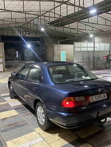 люки крыши: Mazda 323: 1997 г., 1.5 л, Автомат, Бензин, Седан — 5