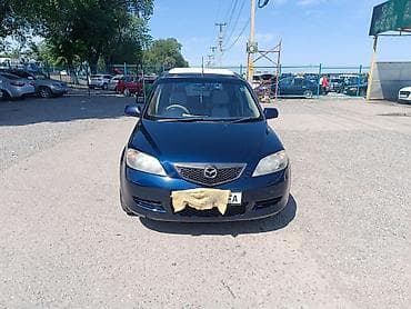 боковой: Mazda Demio: 2004 г., 1.5 л, Автомат, Бензин, Хэтчбэк — 1