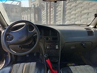 дом на обмен: Kia Sephia: 1997 г., Бензин, Седан — 7