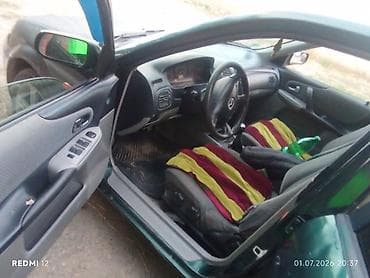 e 303: Mazda Familia: 2003 г., Универсал — 2