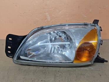автозапчасти для форд фокус 2: Передняя левая фара Ford 2000 г., Б/у — 2