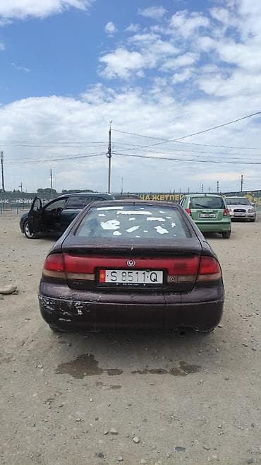 Mazda 626: 1995 г., 2 л, Бензин, Седан — 4