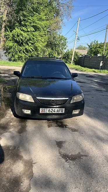 mini copper: Mazda 323: 2001 г., Универсал — 1