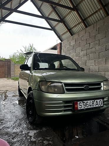 Daihatsu Cuore: 2001 г., 1 л, Механика, Бензин, Хэтчбэк