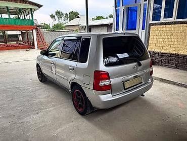 баги: Mazda Demio: 2001 г., 1.3 л, Автомат, Бензин, Хэтчбэк — 4