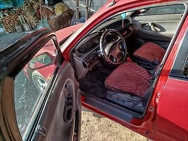 кирг шёлк: Mazda 323: 1995 г., Седан — 9