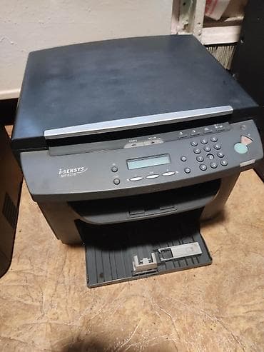 сканеры до 1200: Многофункциональное устройство Canon i-SENSYS MF4018. Это устройство — 1
