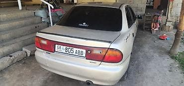 genesis 80: Mazda 323: 1996 г., 1.3 л, Механика, Бензин, Седан — 1
