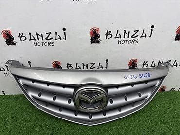ate: Решетка радиатора Mazda 2002 г., Б/у, Оригинал — 1