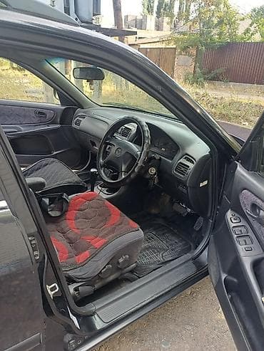 red cell: Mazda Capella: 1998 г., 2 л, Автомат, Бензин, Универсал — 6