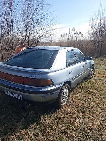 опел вектра с: Mazda 323: 1990 г., Лифтбек — 4