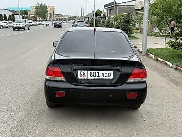 camry 2010: Mitsubishi Lancer: 2006 г., Автомат, Бензин, Седан — 4