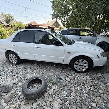 Mazda Familia: 2001 г., Седан