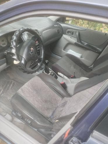 6: Mazda Familia: 2003 г., 1.6 л, Механика, Бензин, Универсал — 4