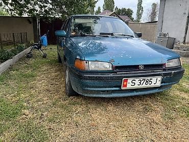 gac aion y: Mazda 323: 1990 г., Механика, Бензин, Седан — 1