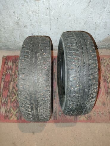 шины на внедорожник: Пара шипованных зимних шин для легкового авто. Характеристики: - — 1