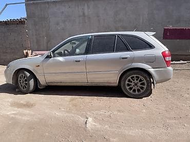 rx 7: Mazda Familia: 2001 г., 1.6 л, Механика, Газ, Универсал — 4