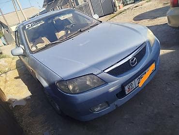 235 60 р18: Mazda 323: 2003 г., 1.6 л, Механика, Бензин, Универсал — 1