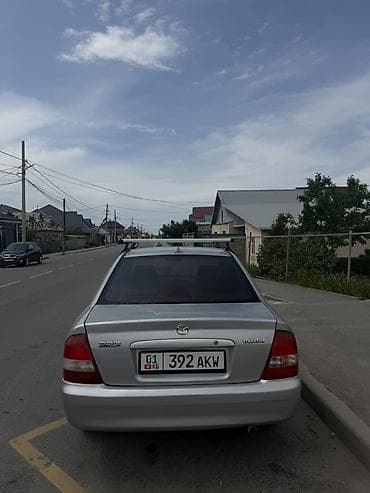 Mazda 323: 2003 г., 1.6 л, Механика, Бензин, Седан — 2