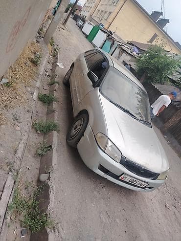 mat: Mazda Familia: 1999 г., 1.5 л, Автомат, Лимузин — 1