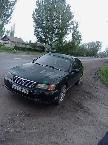 выкуп авто мазда: Седан темно-зеленого цвета, правый руль. Кузов 4-дверный, просторный — 3