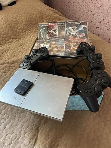 Игровой комплект PlayStation 2 Slim (серебристая) Срочно продаю PS со