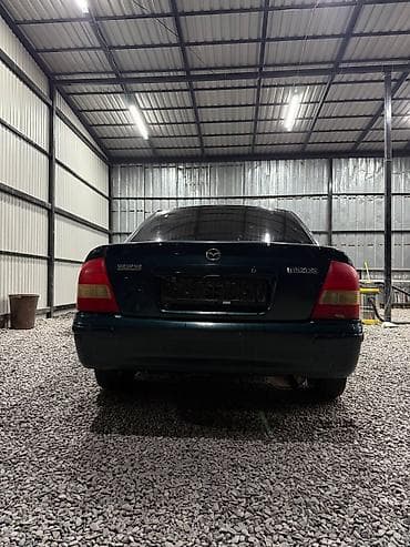е34 люк: Mazda 323: 2000 г., 1.3 л, Механика, Бензин, Седан — 4