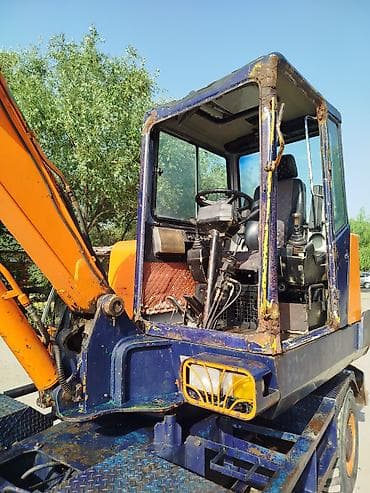 купить колесный экскаватор бу: Экскаватор, Doosan, 1999 г., Колесный — 6