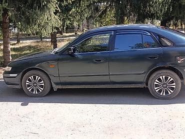 кочкор авто: Mazda 323: 1999 г., 1.8 л, Кол менен иштөөчү, Бензин, Седан — 8