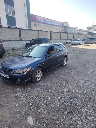 subaru forester 2001: Mazda 323: 2002 г., Механика, Хэтчбэк — 7