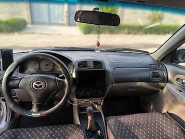 Mazda 323: 2003 г., 2 л, Кол менен иштөөчү, Газ, Хетчбек — 6