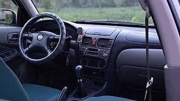 wuling mini ev: Nissan Almera: 2002 г., 1.8 л, Механика, Бензин, Хэтчбэк — 7