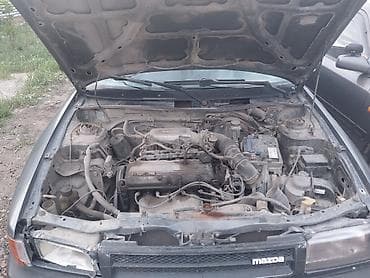 кызыл бирдик: Mazda 323: 1989 г., 1.6 л, Кол менен иштөөчү, Бензин, Седан — 8