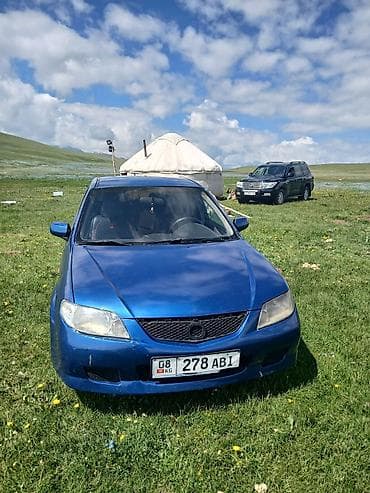 mini kuper: Mazda 323: 2003 г., 1.6 л, Механика, Бензин, Хэтчбэк — 1