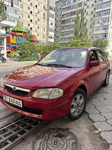 x 5: Mazda 323: 1998 г., 1.5 л, Механика, Бензин, Универсал — 4