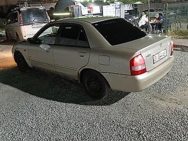 мотор 323: Mazda 323: 2001 г., Седан — 4