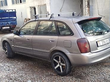 mazda cronos: Mazda 323: 2002 г., Механика, Бензин, Универсал — 2