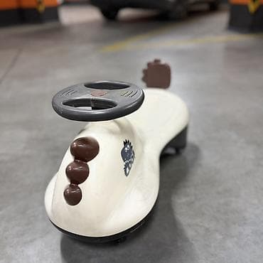 маленькие электро машины: Детская каталка-катамаран (wiggle car) в виде динозаврика — 1