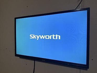купить диски с фильмами: Телевизор Skyworth, диагональ примерно 32–40". Плоская LED‑панель — 2