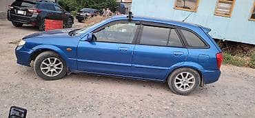 Mazda 323: 2002 г., Механика, Бензин, Хэтчбэк — 1
